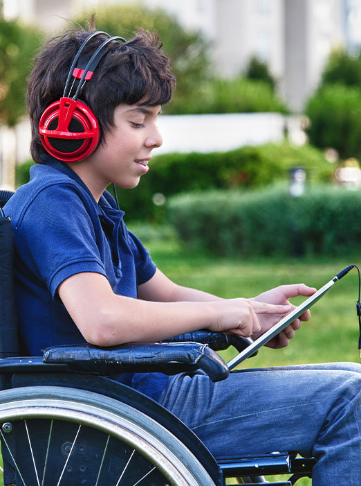 Kid on wheel chair taking class